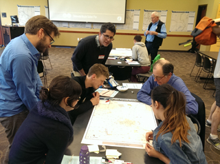 bike enthusiasts working on map