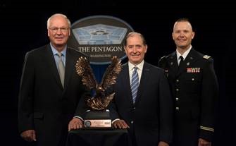 MnDOT Commissioner Charlie Zelle receiving the Freedom Award at an Aug. 24 ceremony in Washington, D.C. from Craig Mckinley, ESGR National Chair. Capt. TJ Melcher (right) nominated MnDOT for the award.