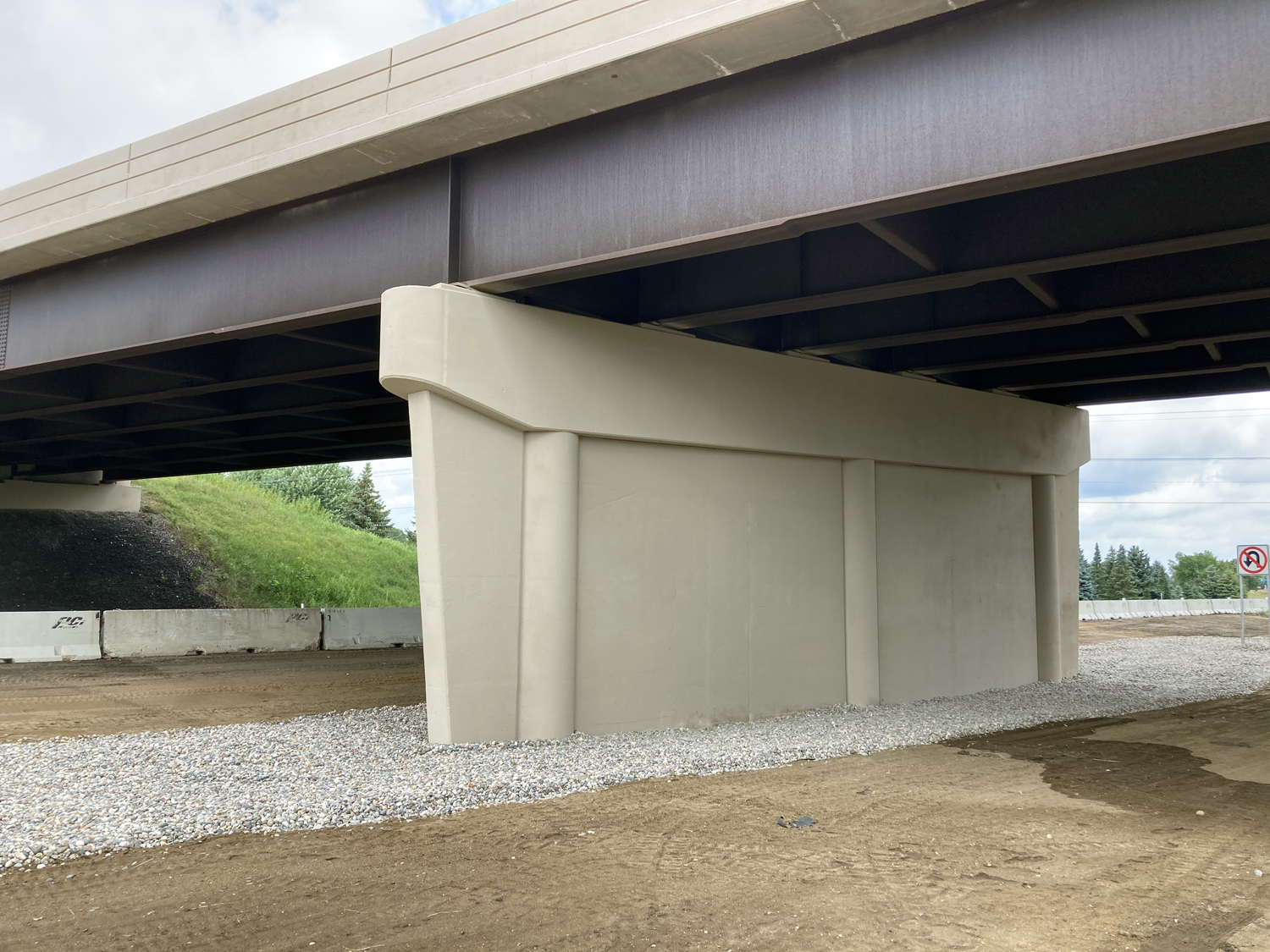 Photo of completed concrete fill of the center pier in the Hwy 15 median Photo of completed concrete fill of the center pier in the Hwy 15 median